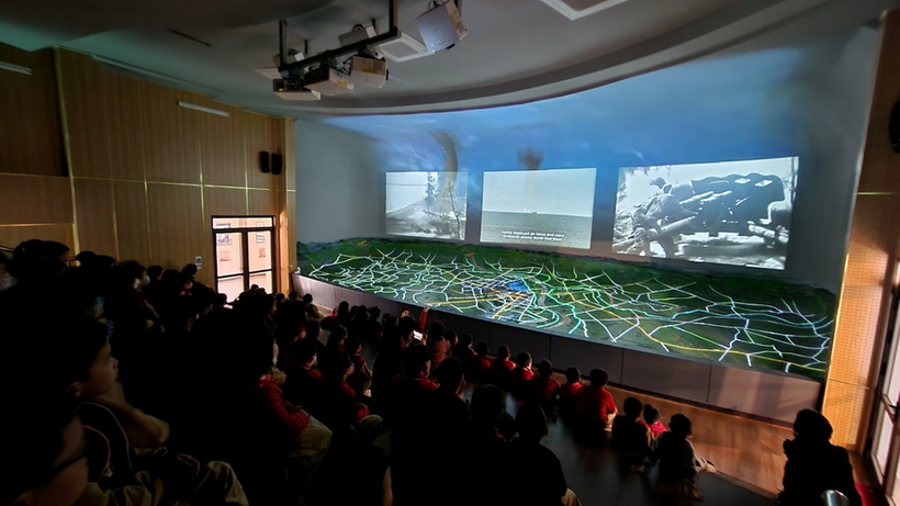 A picture containing indoor, ceiling, person, peopleDescription automatically generated