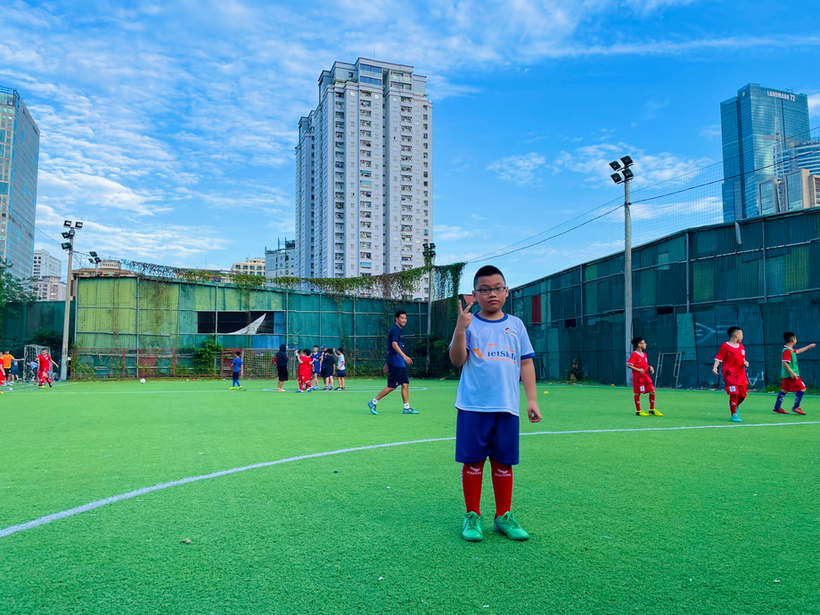 A person standing on a football field

Description automatically generated with medium confidence