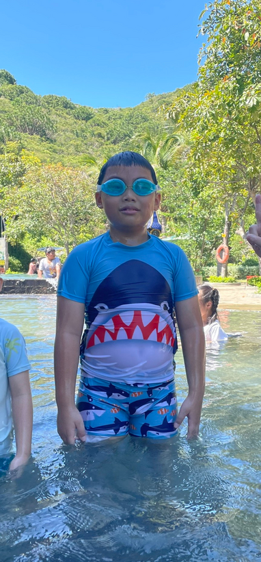 A child standing in water
Description automatically generated with low confidence