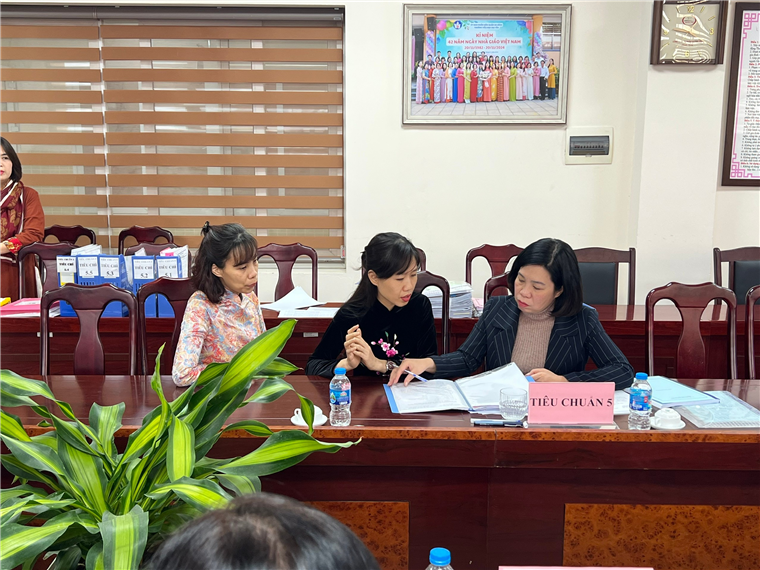 A group of women sitting at a table
Description automatically generated