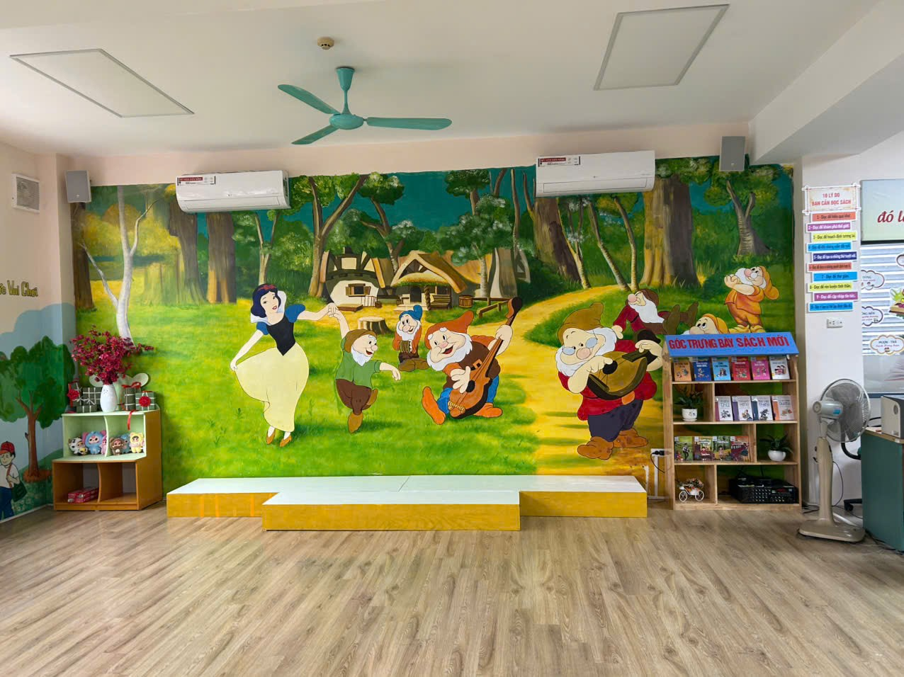 A room with a mural on the wall
Description automatically generated