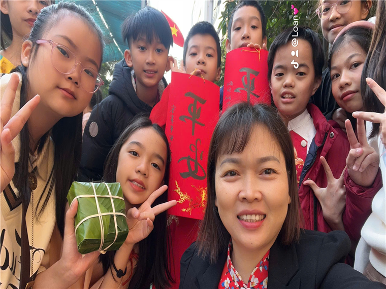 A group of people posing for a photo
Description automatically generated