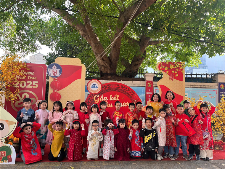 A group of people posing for a photo
Description automatically generated