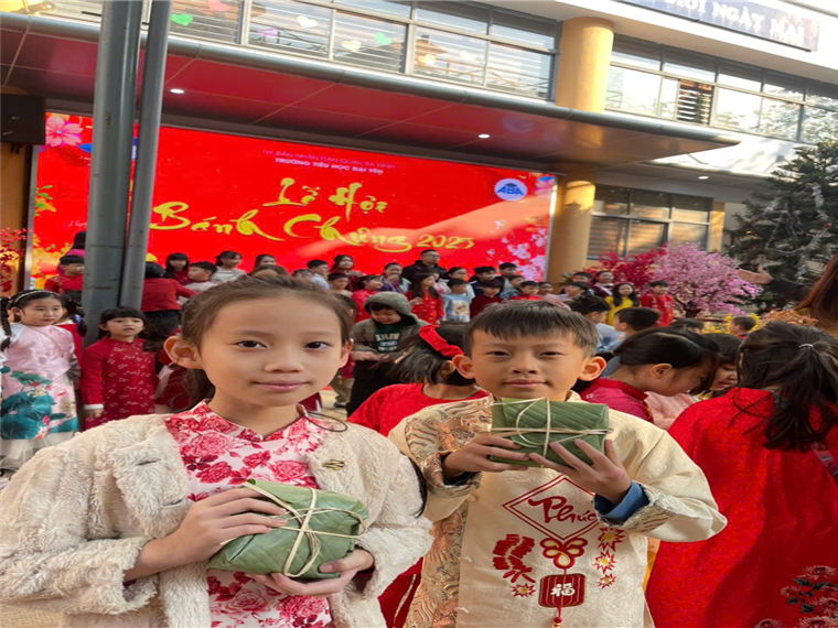 A group of children holding wrapped presents
Description automatically generated