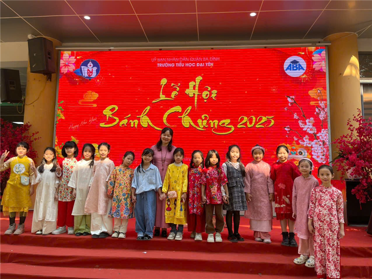 A group of children standing in front of a large sign
Description automatically generated