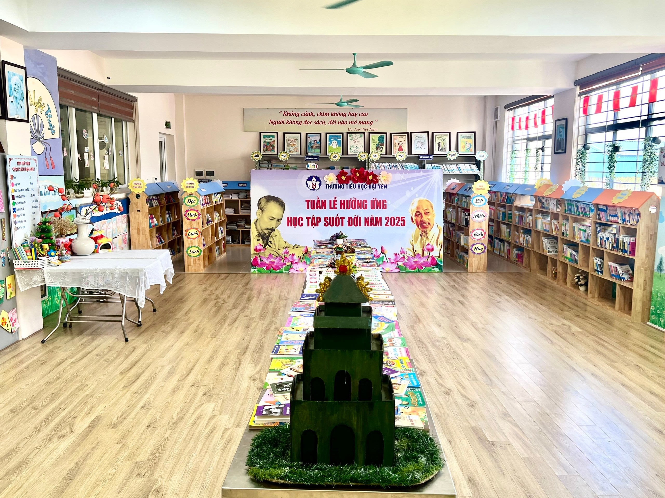 A room with a table and books
AI-generated content may be incorrect.