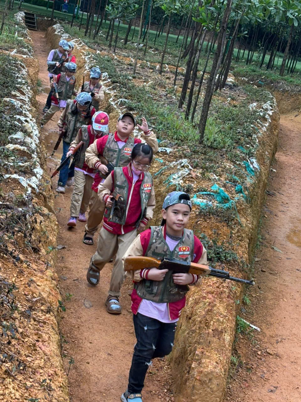 A group of children walking on a path

AI-generated content may be incorrect.