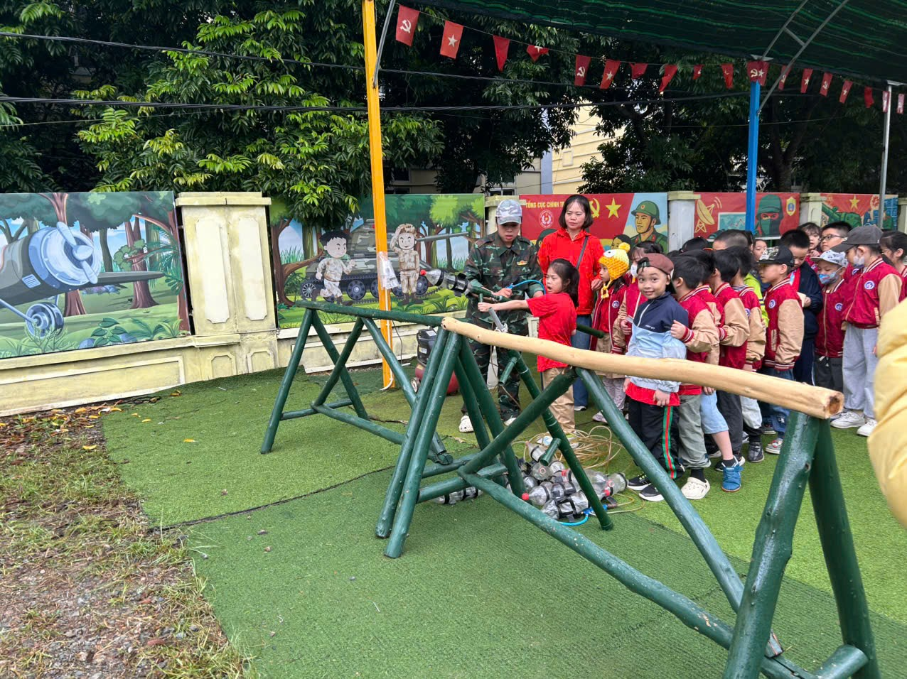 A group of children standing in front of a wall

AI-generated content may be incorrect.