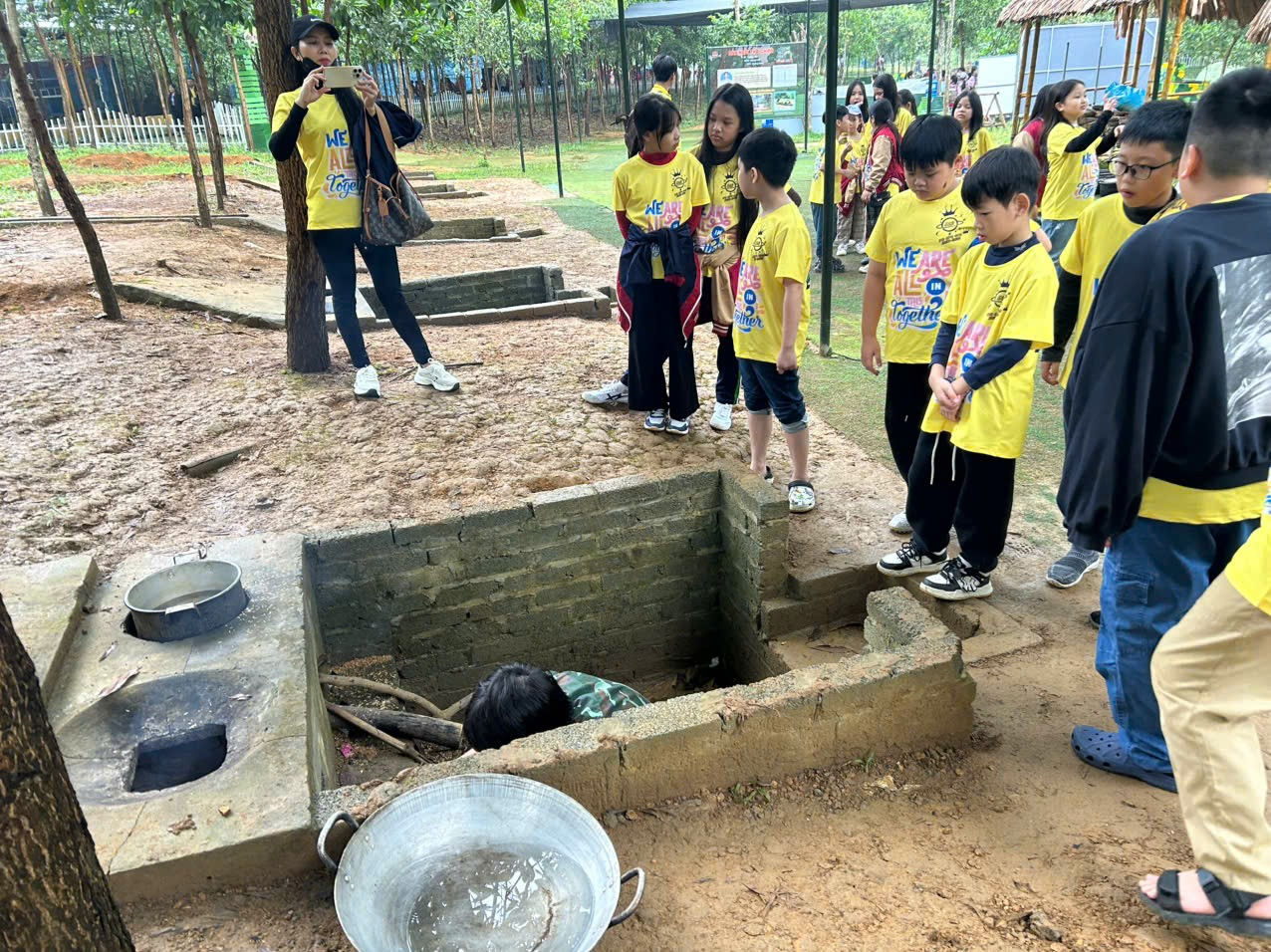 A group of children standing in a line

AI-generated content may be incorrect.