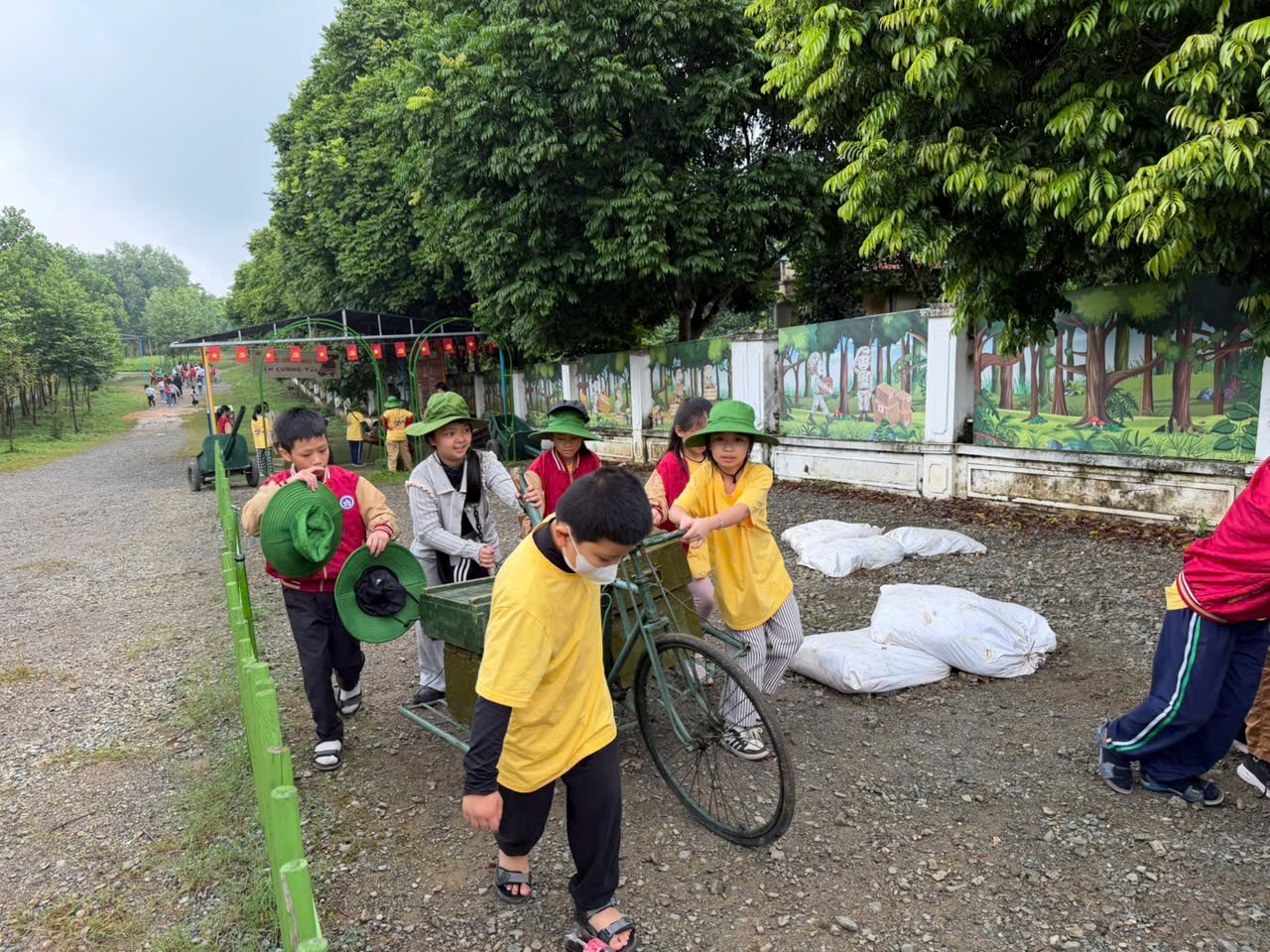 A group of people walking on a dirt road

AI-generated content may be incorrect.