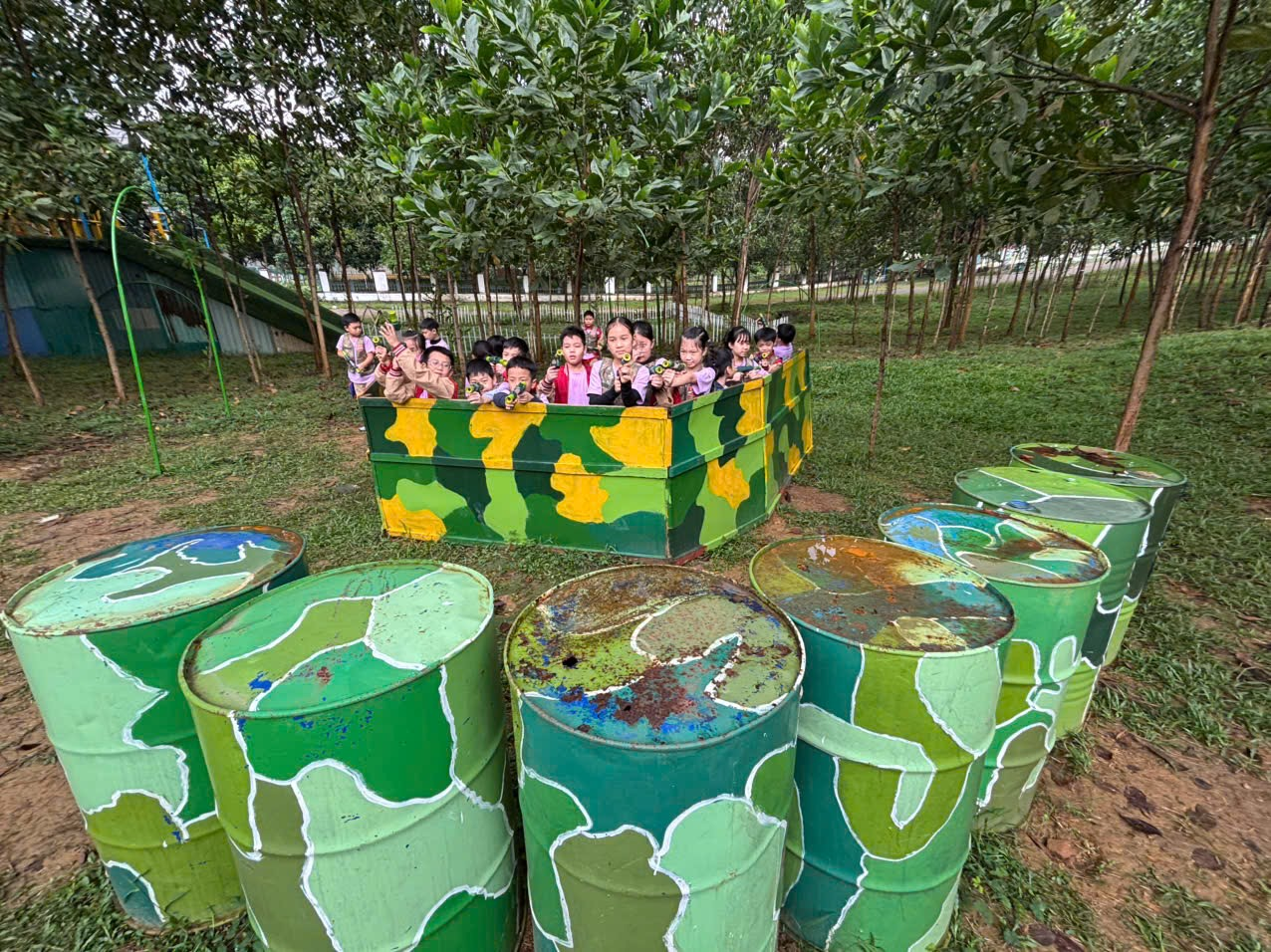 A group of children in a box with barrels

AI-generated content may be incorrect.