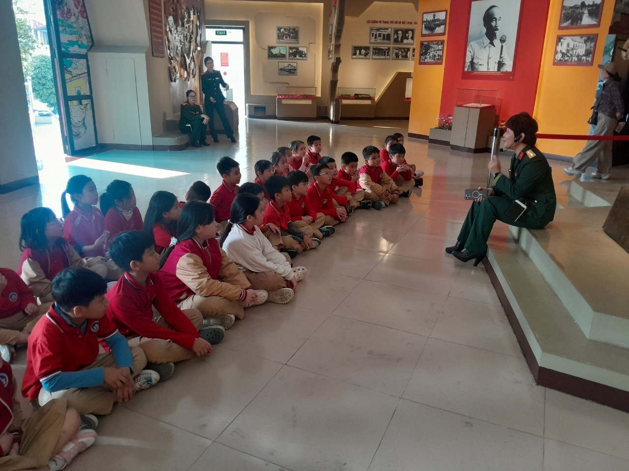 A group of children sitting on the floor

AI-generated content may be incorrect.