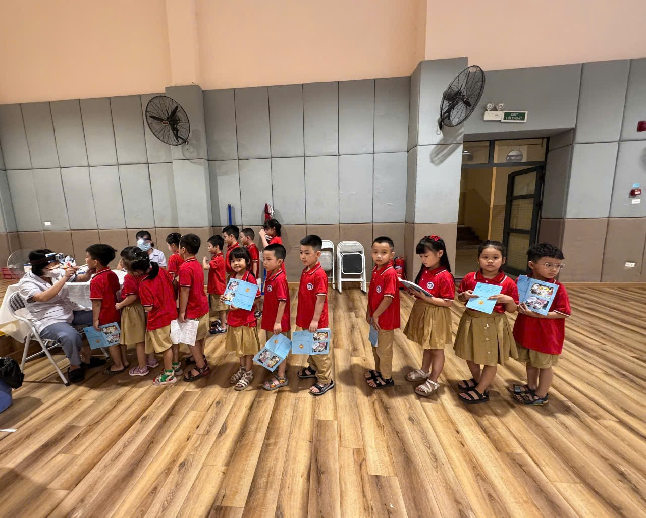 A group of children in red shirts
AI-generated content may be incorrect.