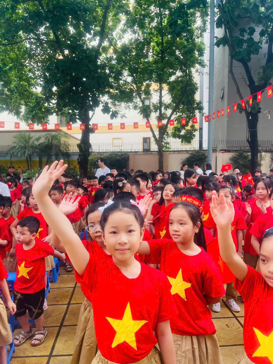 A group of children in red shirts
AI-generated content may be incorrect.