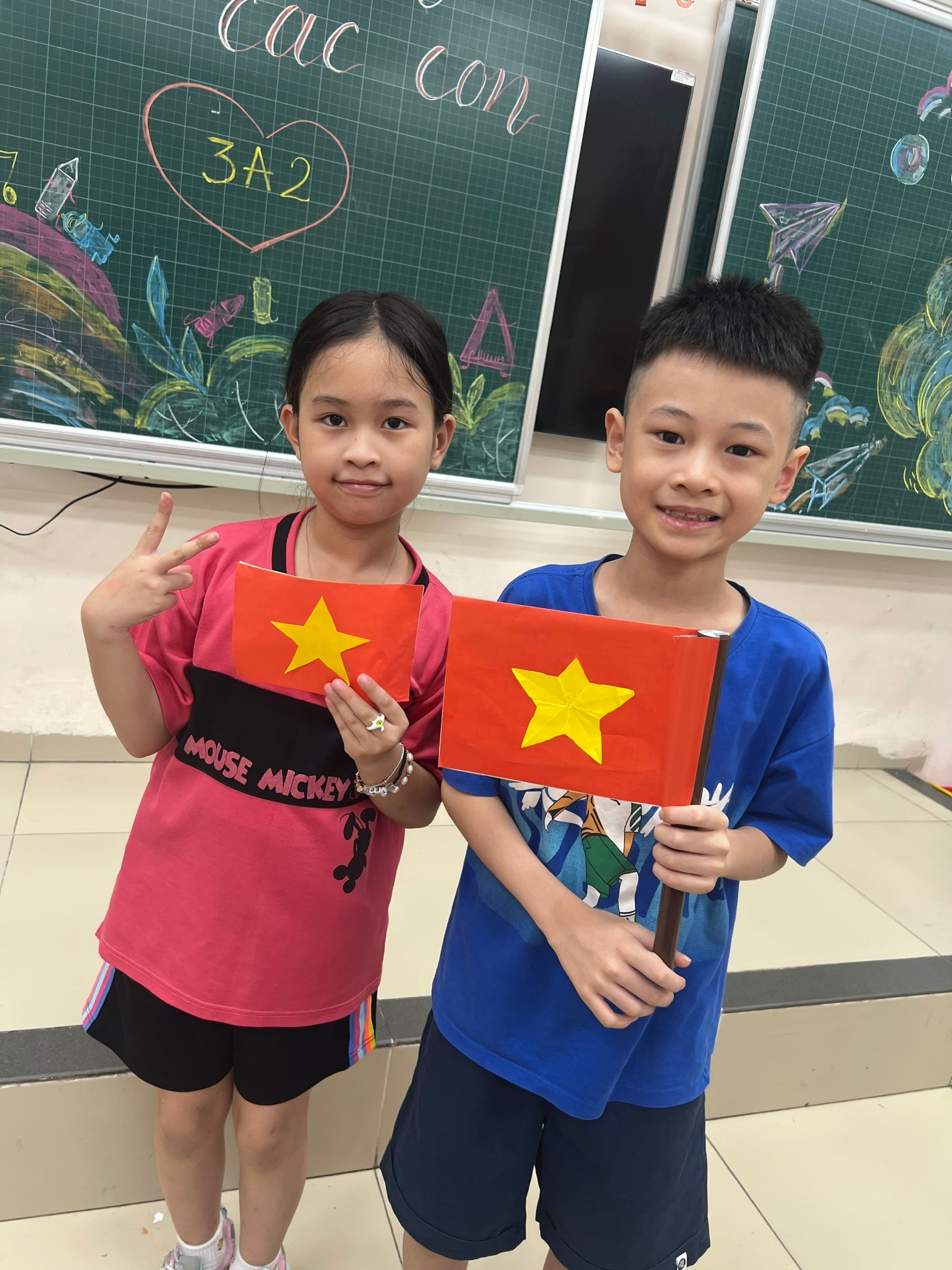 A child and child holding flags
AI-generated content may be incorrect.
