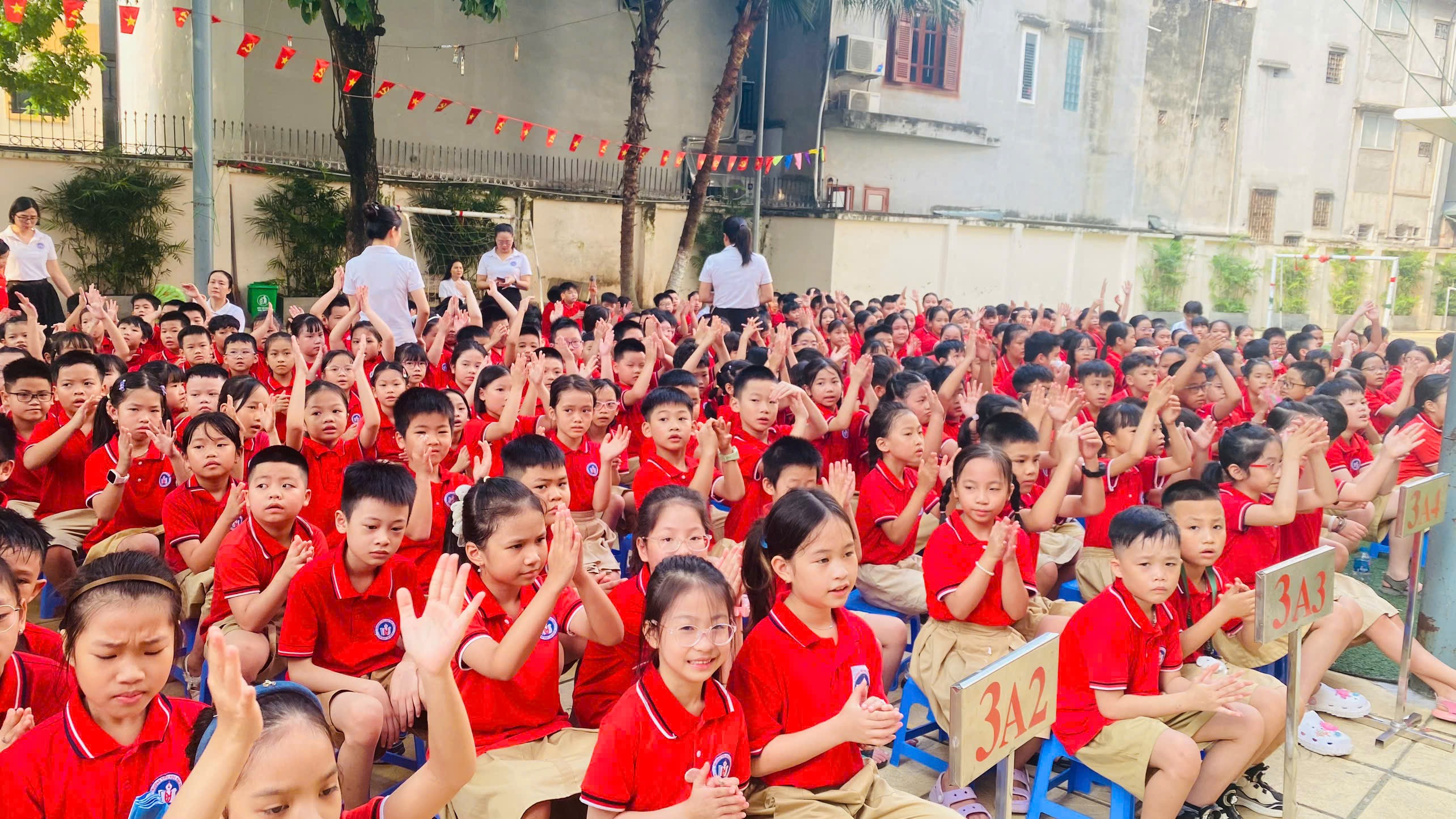 A group of children in red shirts

AI-generated content may be incorrect.