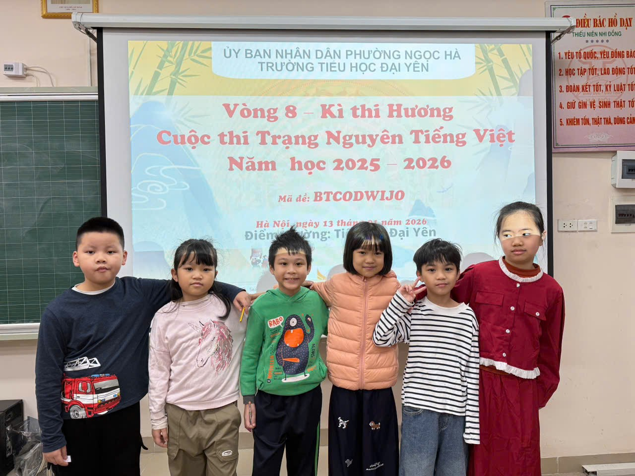 A group of children standing in front of a sign

AI-generated content may be incorrect.