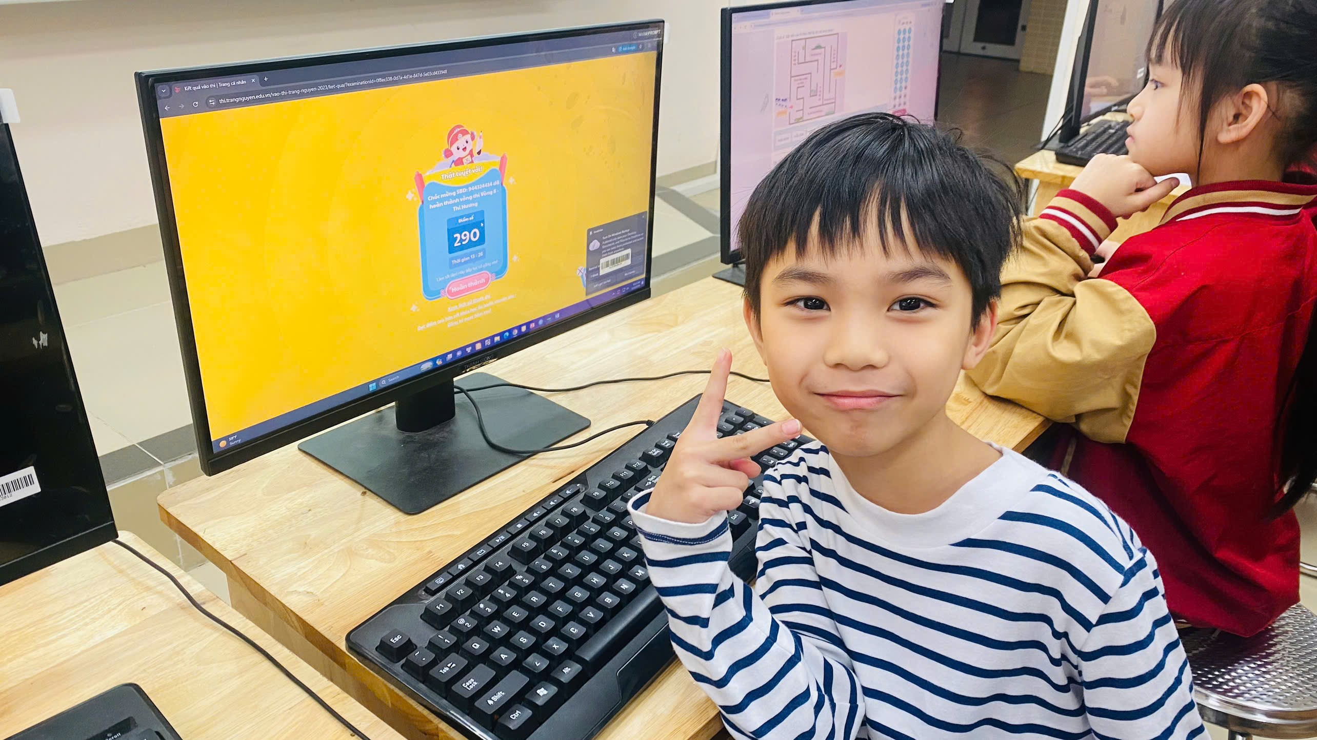 A child sitting in front of a computer

AI-generated content may be incorrect.