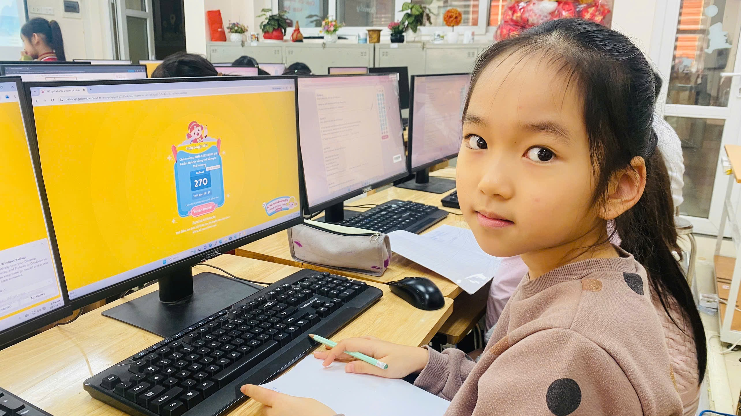 A child sitting at a desk with computer screens

AI-generated content may be incorrect.
