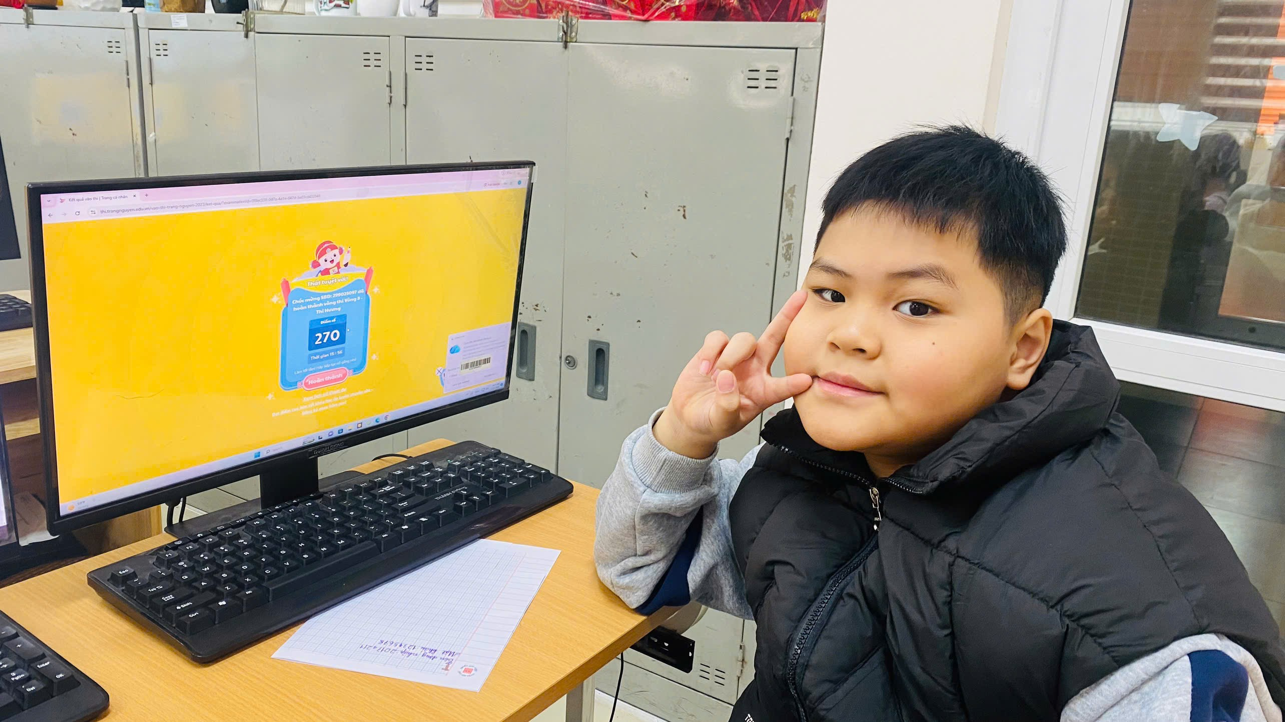 A child sitting at a desk with a computer

AI-generated content may be incorrect.