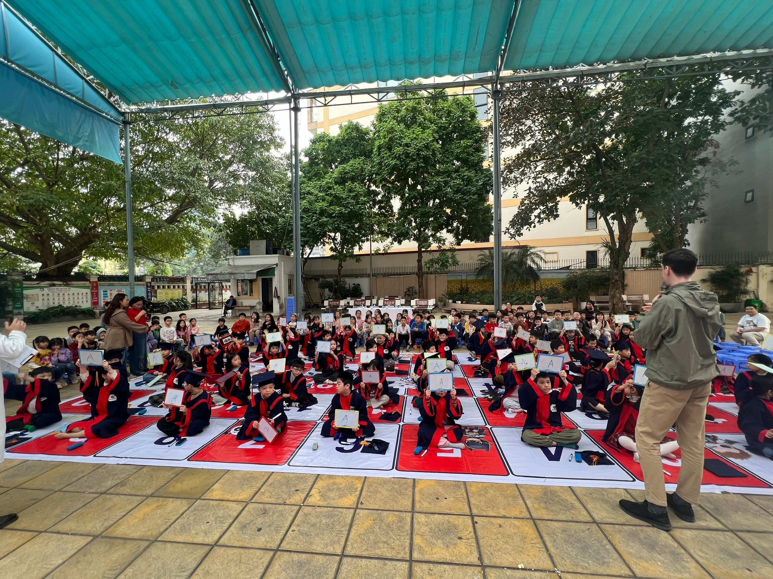 A group of people sitting on a mat

AI-generated content may be incorrect.