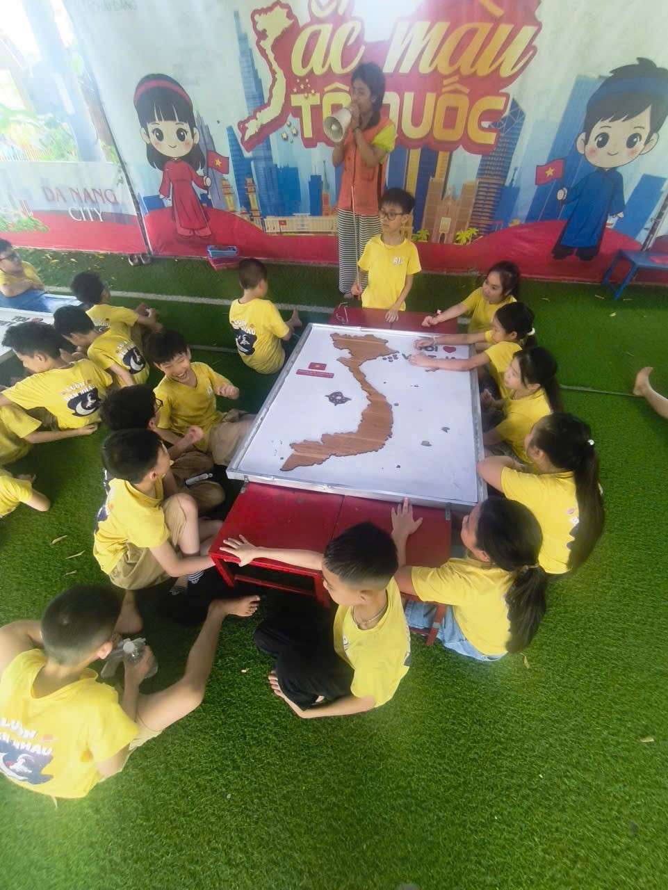 A group of children sitting around a table

AI-generated content may be incorrect.