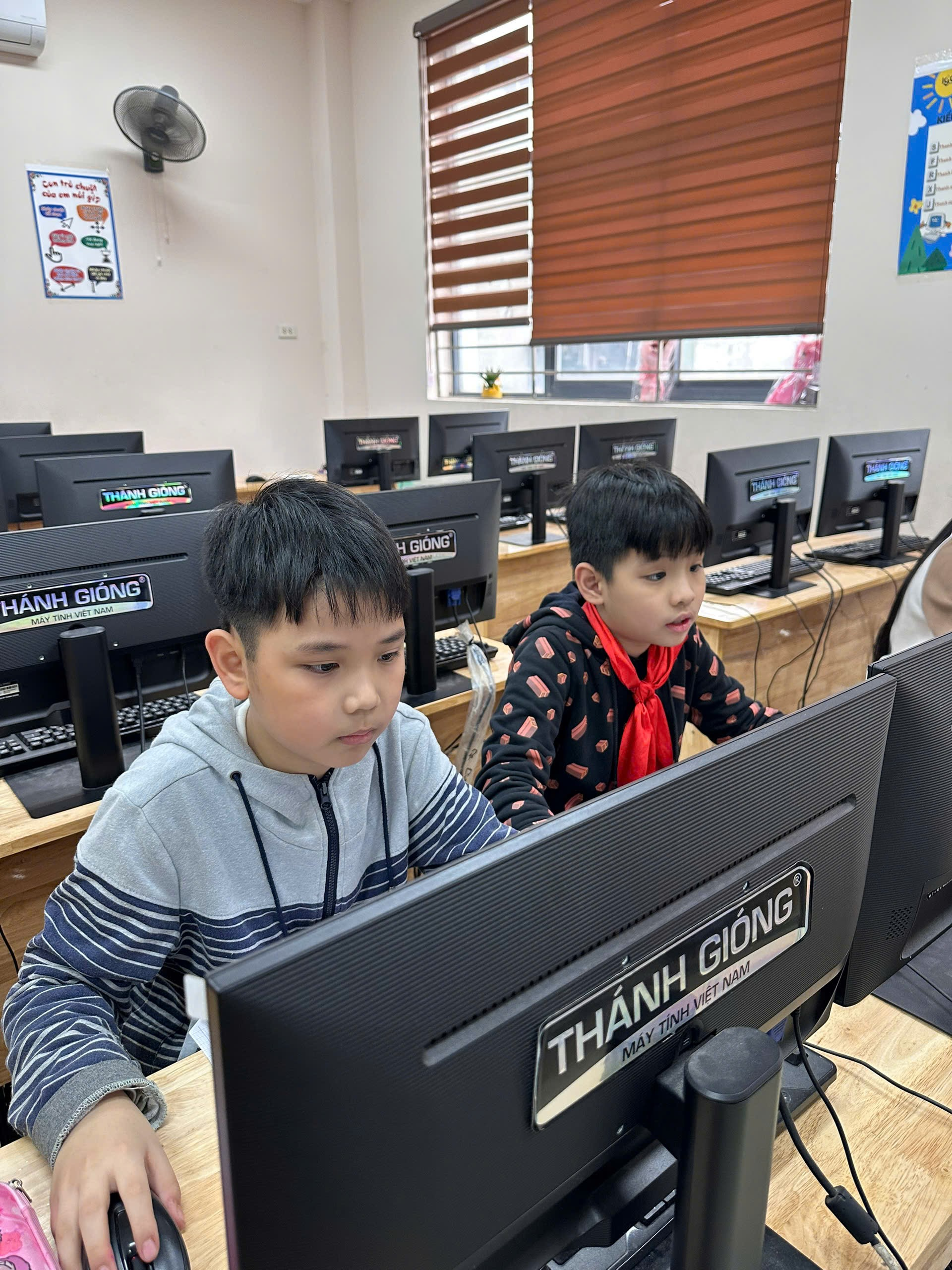 A group of boys sitting at computers

AI-generated content may be incorrect.