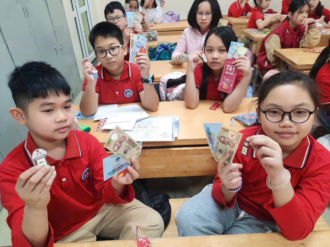 A group of children in a classroom holding money

AI-generated content may be incorrect.